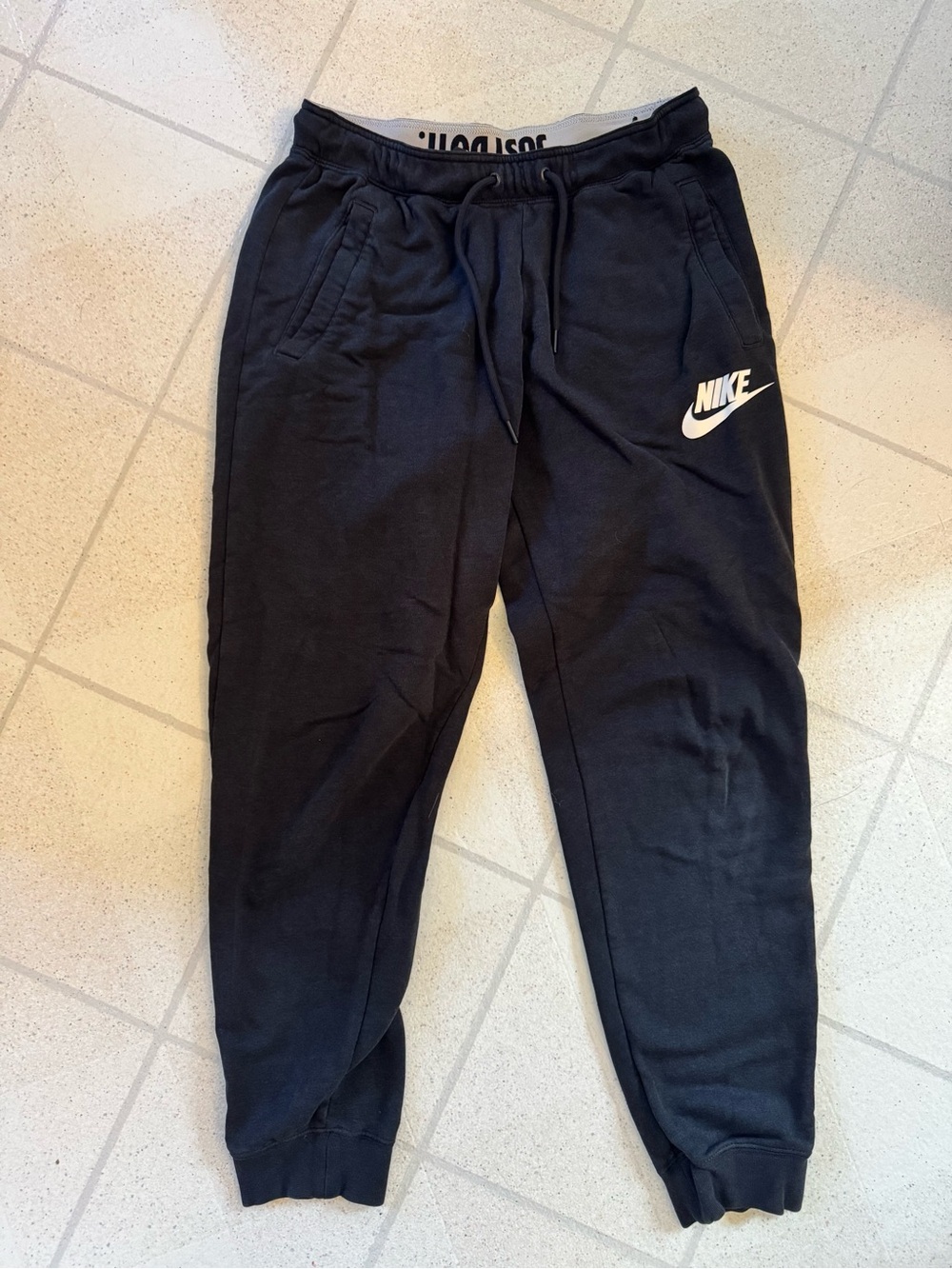 Nike Womenโs Black Jogger Sweatpants with White Logo